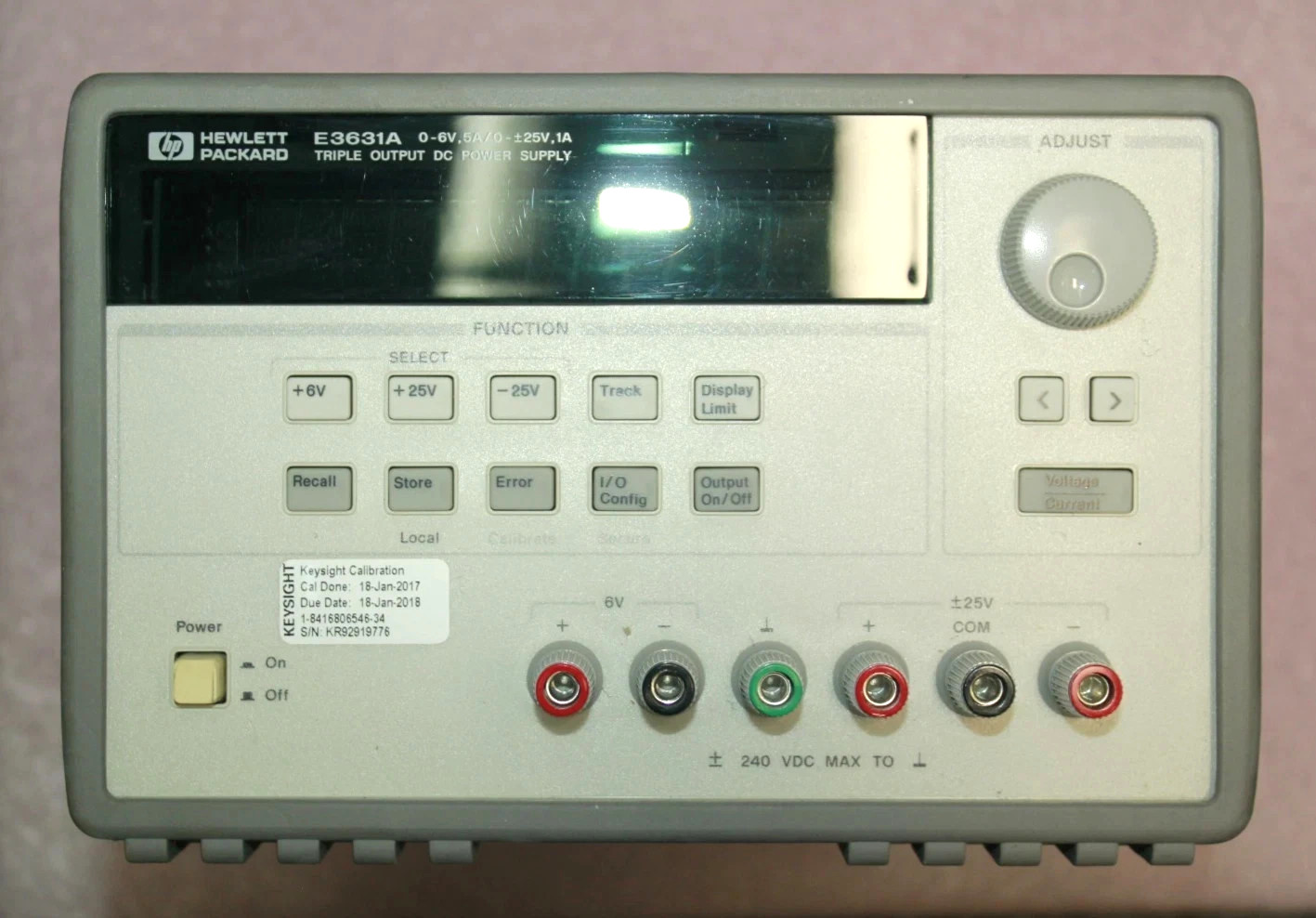 HP E3631A triple output DC power supply front panel